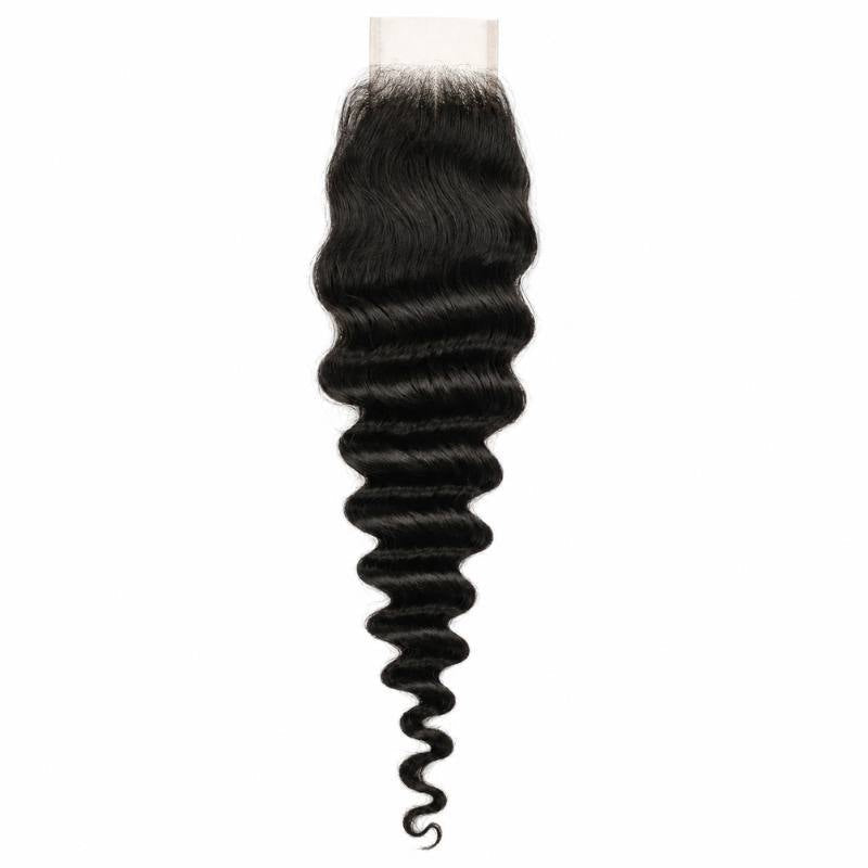 Natural black 2x6 transparent closure laid flat on white with the lace panel at the top and deep wave hair extensions tapering to a curled tip