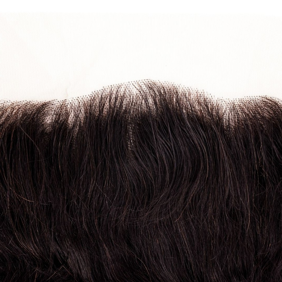 Close-up of individual knots along the frontal lace edge and the fine hairline of natural black loose wave hair extensions