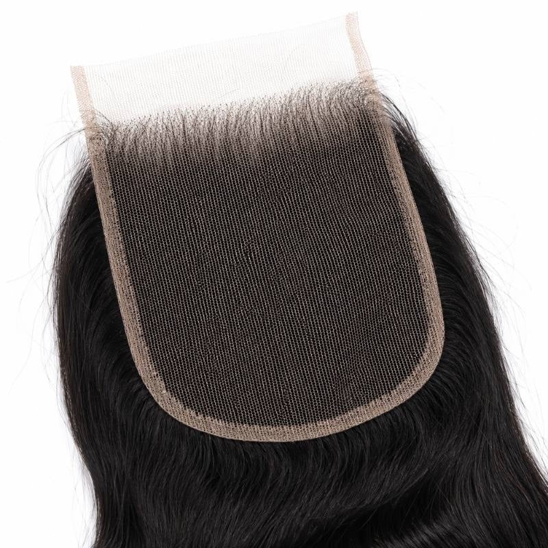 Underside of the 4x4 HD closure showing the lace base and knotted hairline on natural black loose wave hair extensions