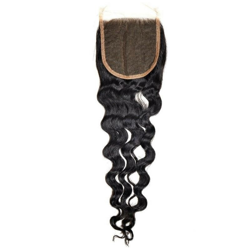 Transparent lace base folded back at the top of the 4x4 closure above wavy natural black loose wave hair extensions