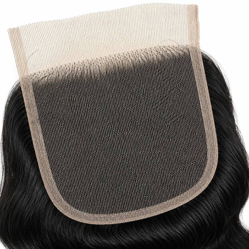Detail of the transparent lace base and its knotted hairline on the underside of natural black loose wave hair extensions