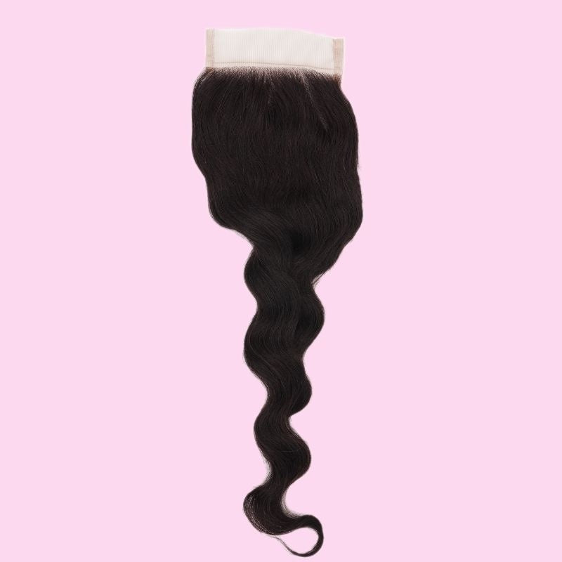 4x4 transparent closure displayed on a pink backdrop with natural black loose wave hair extensions curving to a rounded tip