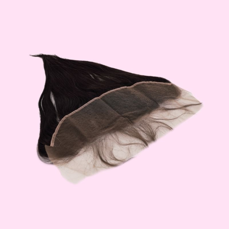 Transparent frontal curved on a pink background to show the lace panel and the straight natural black hair extensions behind it