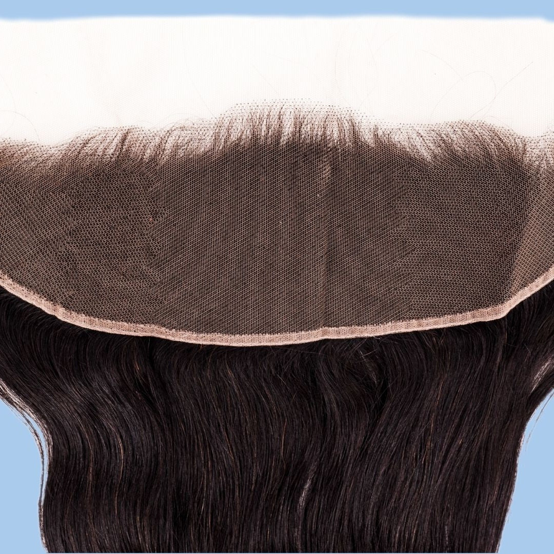 Second close-up of the transparent lace mesh and bound edge on the frontal above straight natural black hair extensions