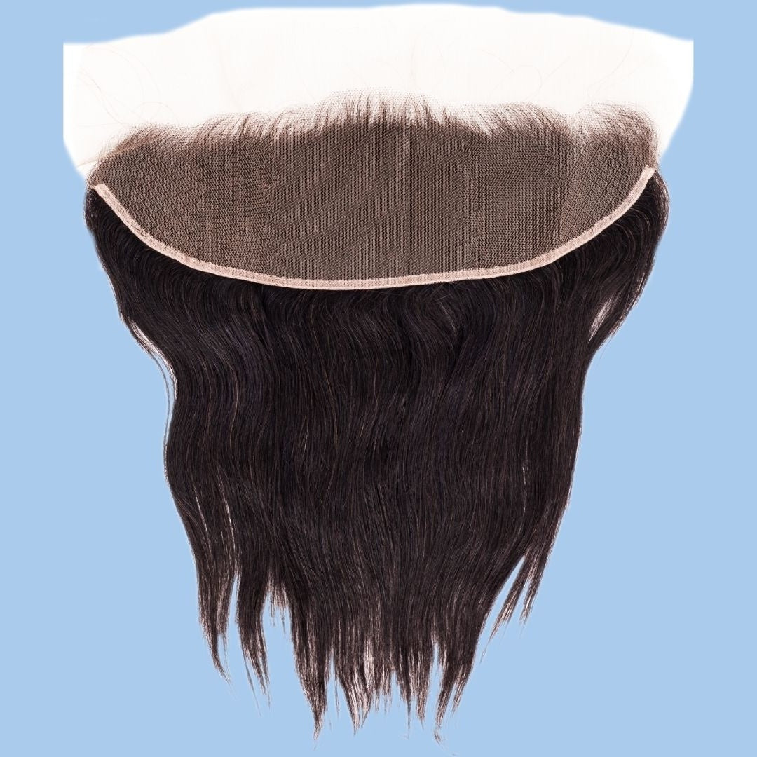 Transparent lace panel folded back on a blue background above the straight natural black hair extensions of the frontal