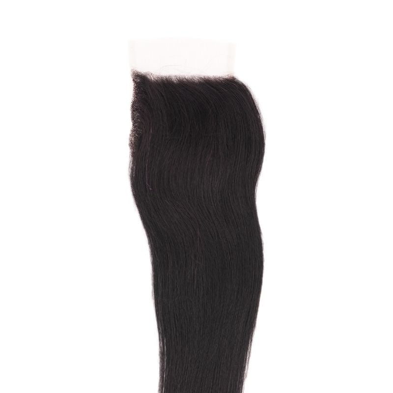 4x4 HD closure laid flat on a white background with straight natural black hair extensions combed down from the lace base