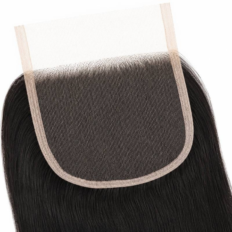 Underside detail of the 4x4 HD closure showing the lace base, bound edge and knotted hairline on straight natural black hair extensions