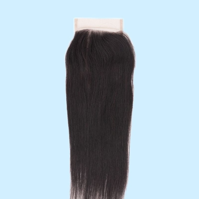 4x4 transparent closure shown against a light blue backdrop with straight natural black hair extensions falling evenly from the parting