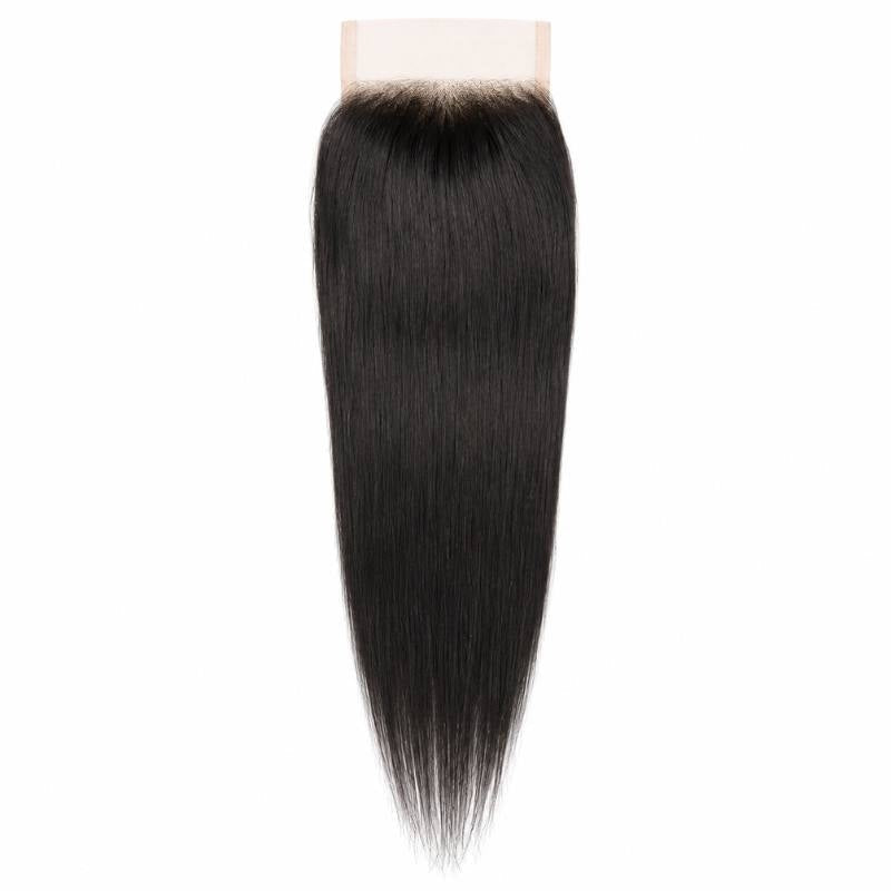 4x4 transparent closure laid flat on a white background with straight natural black hair extensions falling from the lace base