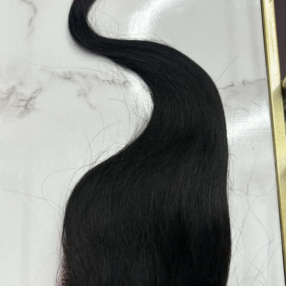 14 inch Brazilian straight 5x5 HD closure hair extension in gold frame showing full piece with S-curve styling from lace to tips