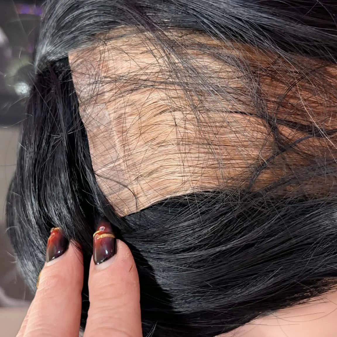 Close-up of 14 inch Brazilian straight 5x5 HD lace closure hair extension installed on mannequin showing transparent lace blend
