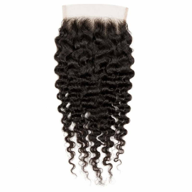 5x5 HD lace closure laid flat on a white background showing the spiral curl pattern of natural black curly hair extensions