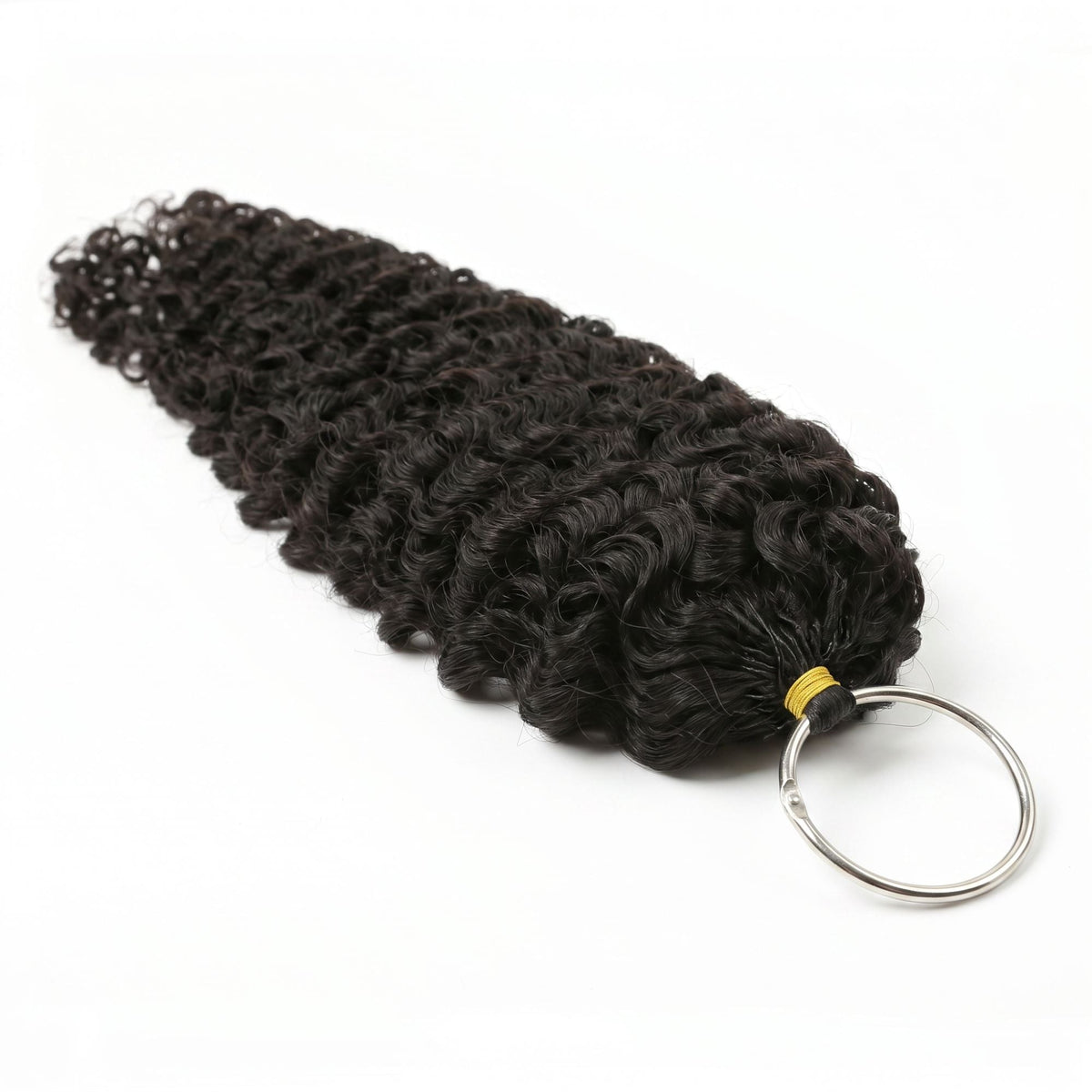 Bundle of natural black curly crochet hair extensions gathered at a yellow band with a metal loop ring on a white background