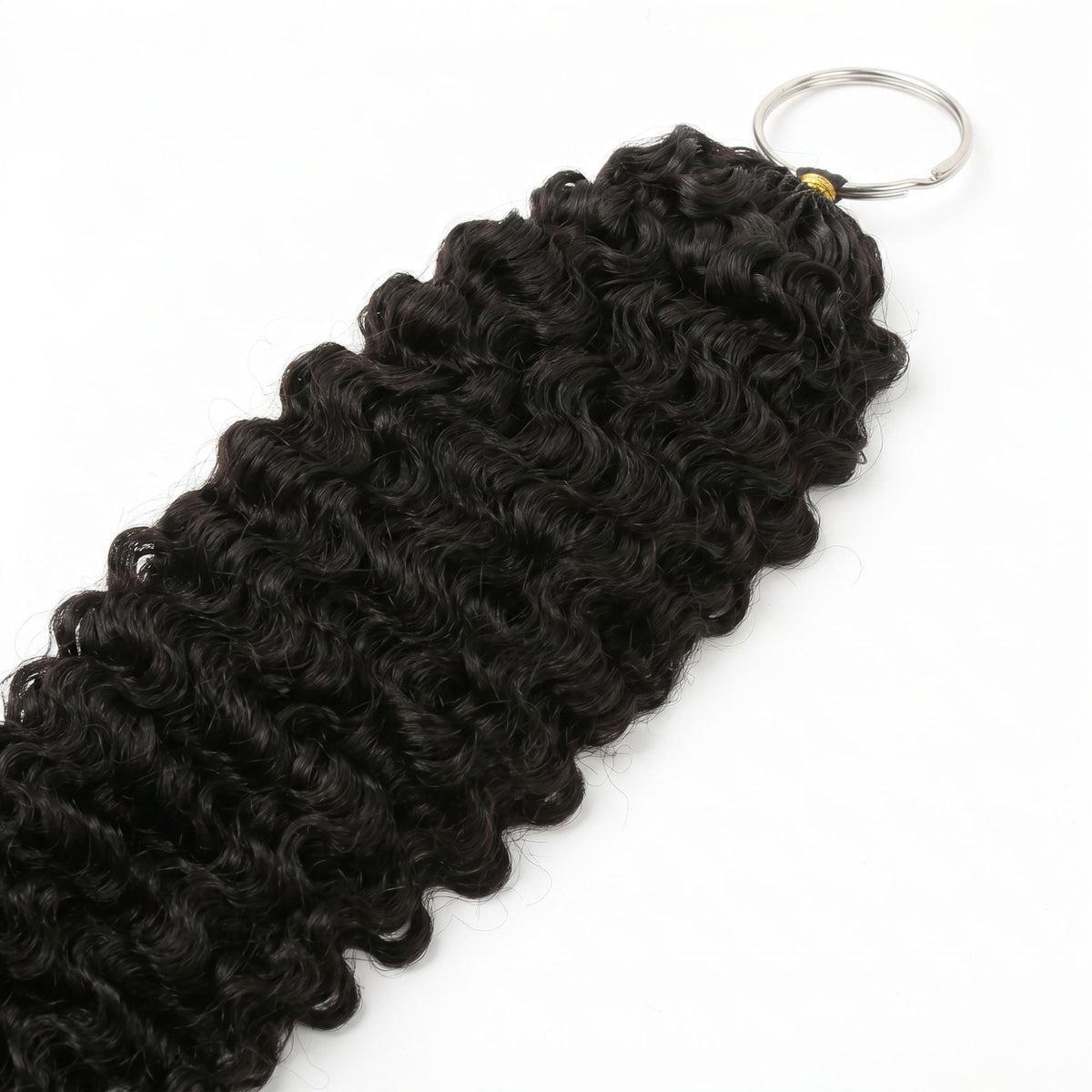 Close-up of the curl pattern on natural black curly crochet hair extensions with the metal loop ring at the top