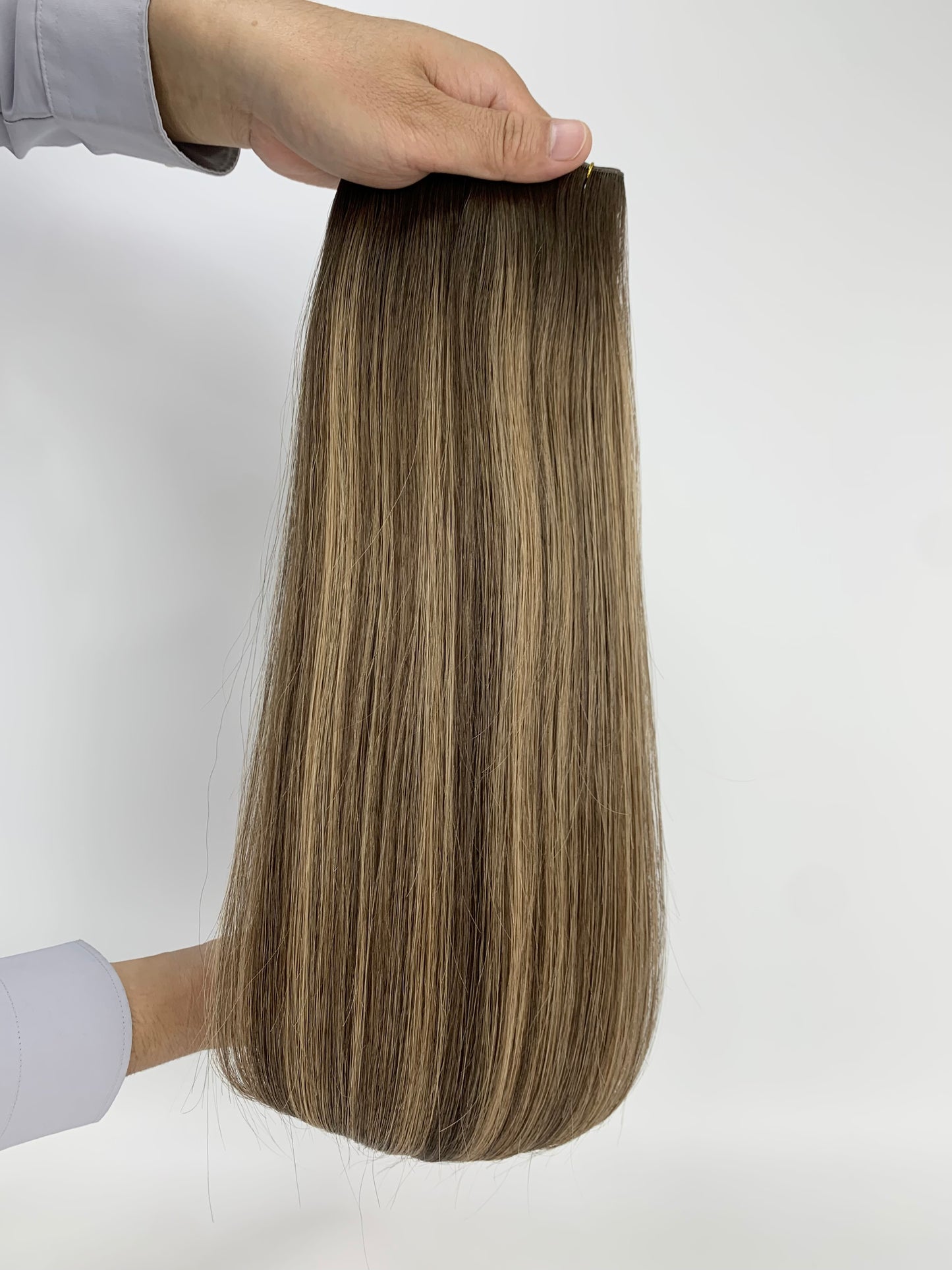 Butterfly Genius Weft - 100% Virgin Human Hair Extensions - rooted brown to blonde balayage (#TAD) color swatch
