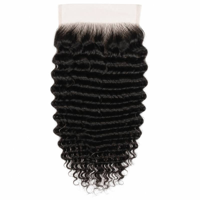 6x6 HD lace closure laid flat on a white background showing the deep wave ripples of natural black hair extensions