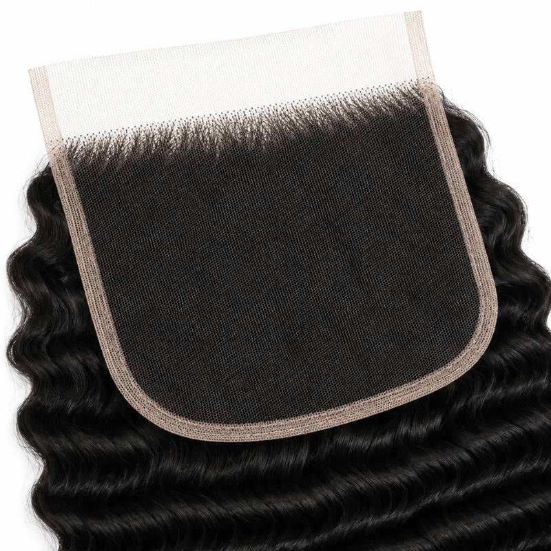 Underside of the 6x6 HD lace closure showing the square lace base and knotted hairline with natural black deep wave hair extensions