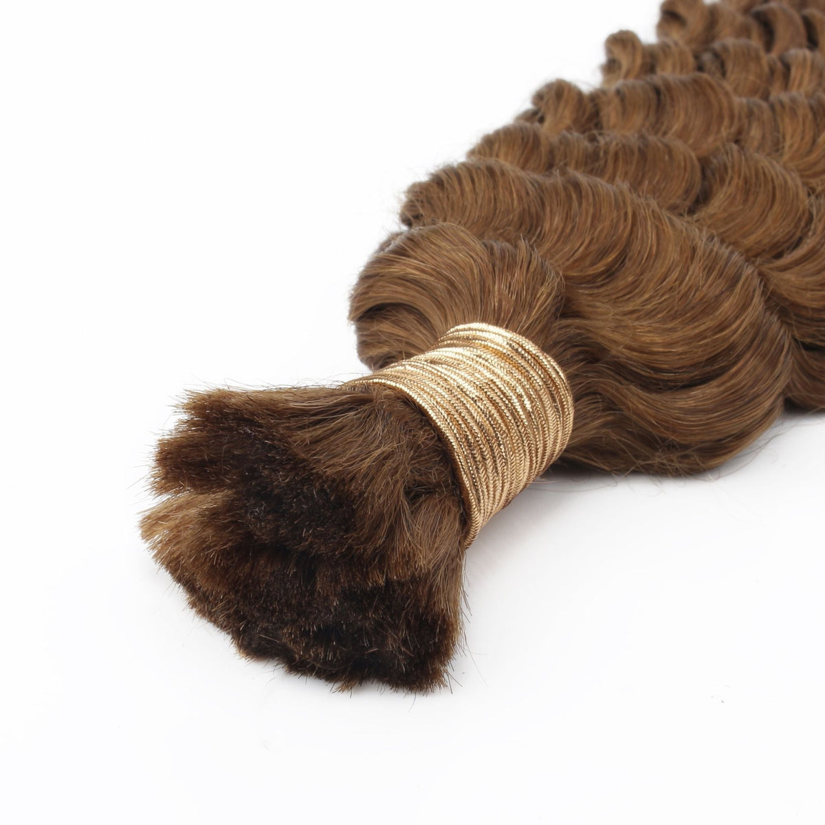 Close-up of the gold thread tie binding the root of a bundle of auburn deep wave bulk braiding hair extensions