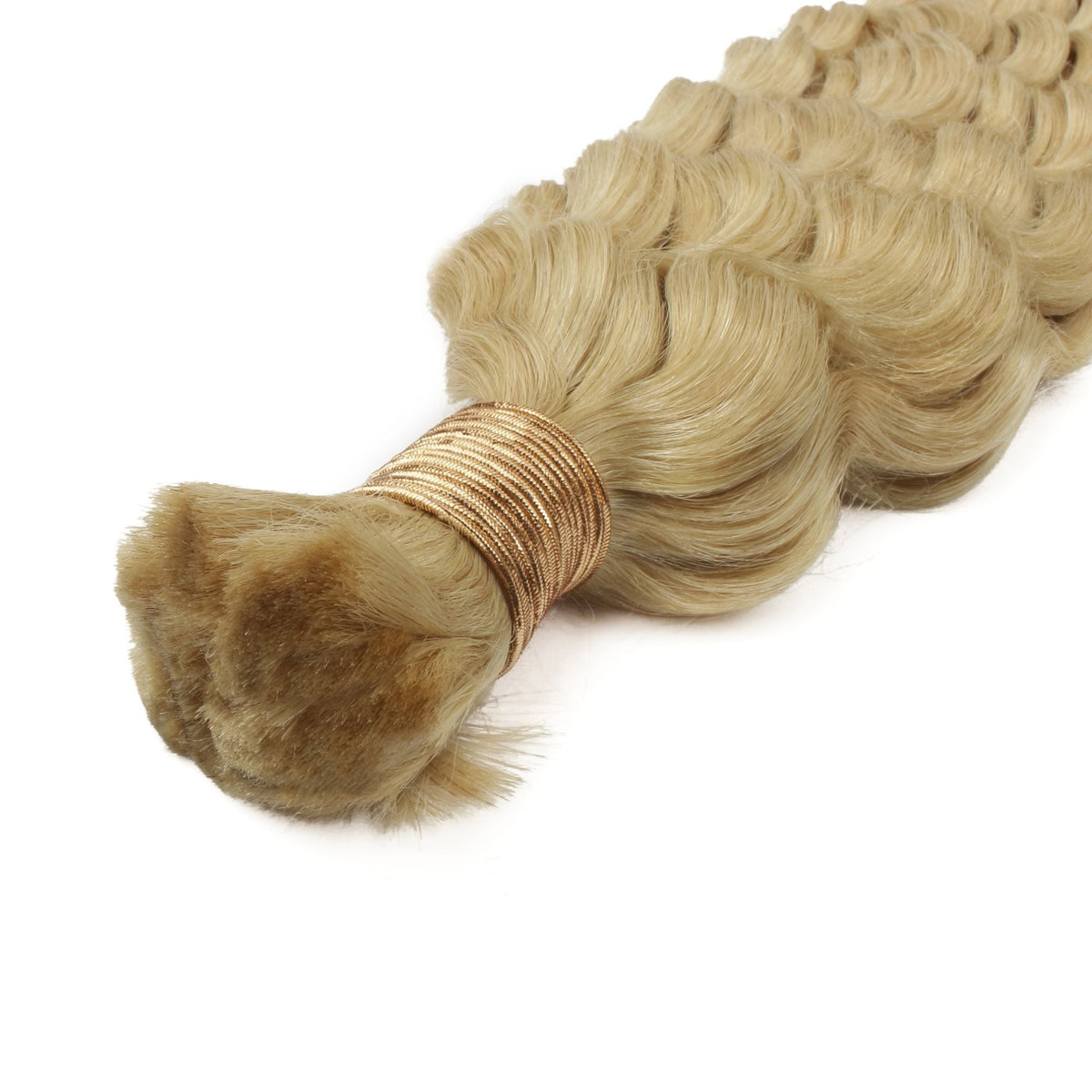 Close-up of the gold thread tie at the root of a bundle of blonde deep wave bulk braiding hair extensions