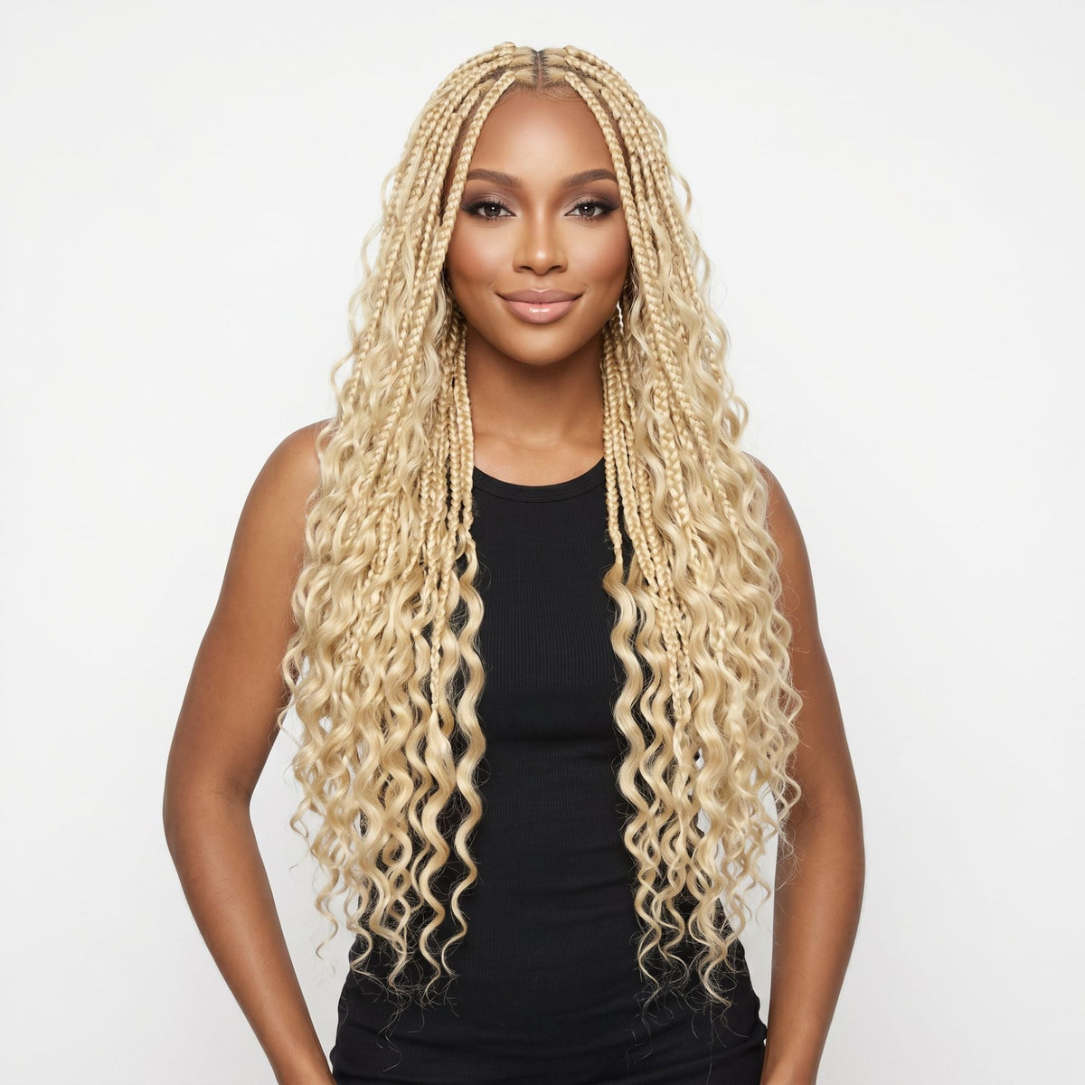 Model wearing blonde boho braids with deep wave ends made from bulk braiding hair extensions, front view on a white background