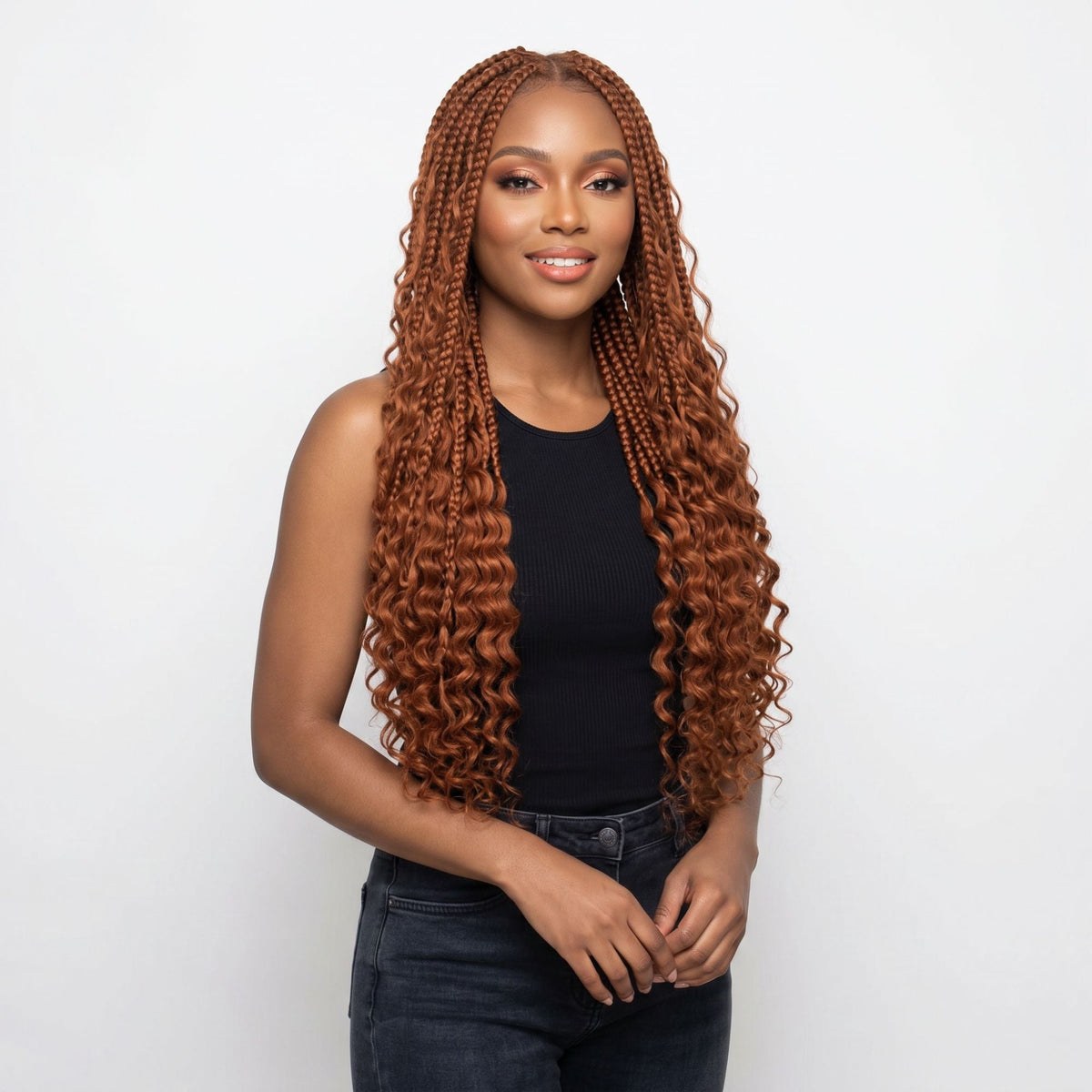 Model wearing copper deep wave bulk braiding hair extensions in long box braids with loose curly ends on a white background