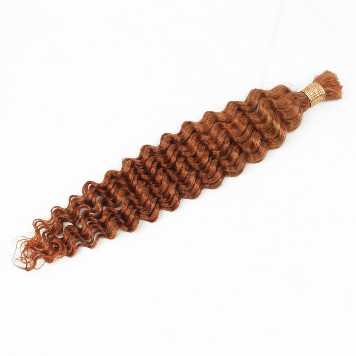 Single bundle of copper deep wave bulk braiding hair extensions laid flat on white showing the whole bundle and its wave pattern