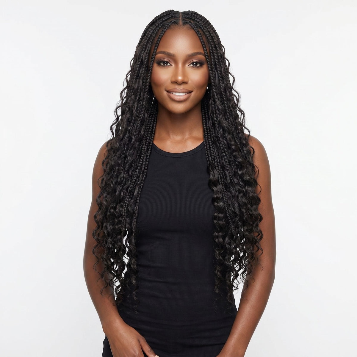 Model wearing natural black deep wave bulk braiding hair extensions in long box braids with loose curly ends on a white background