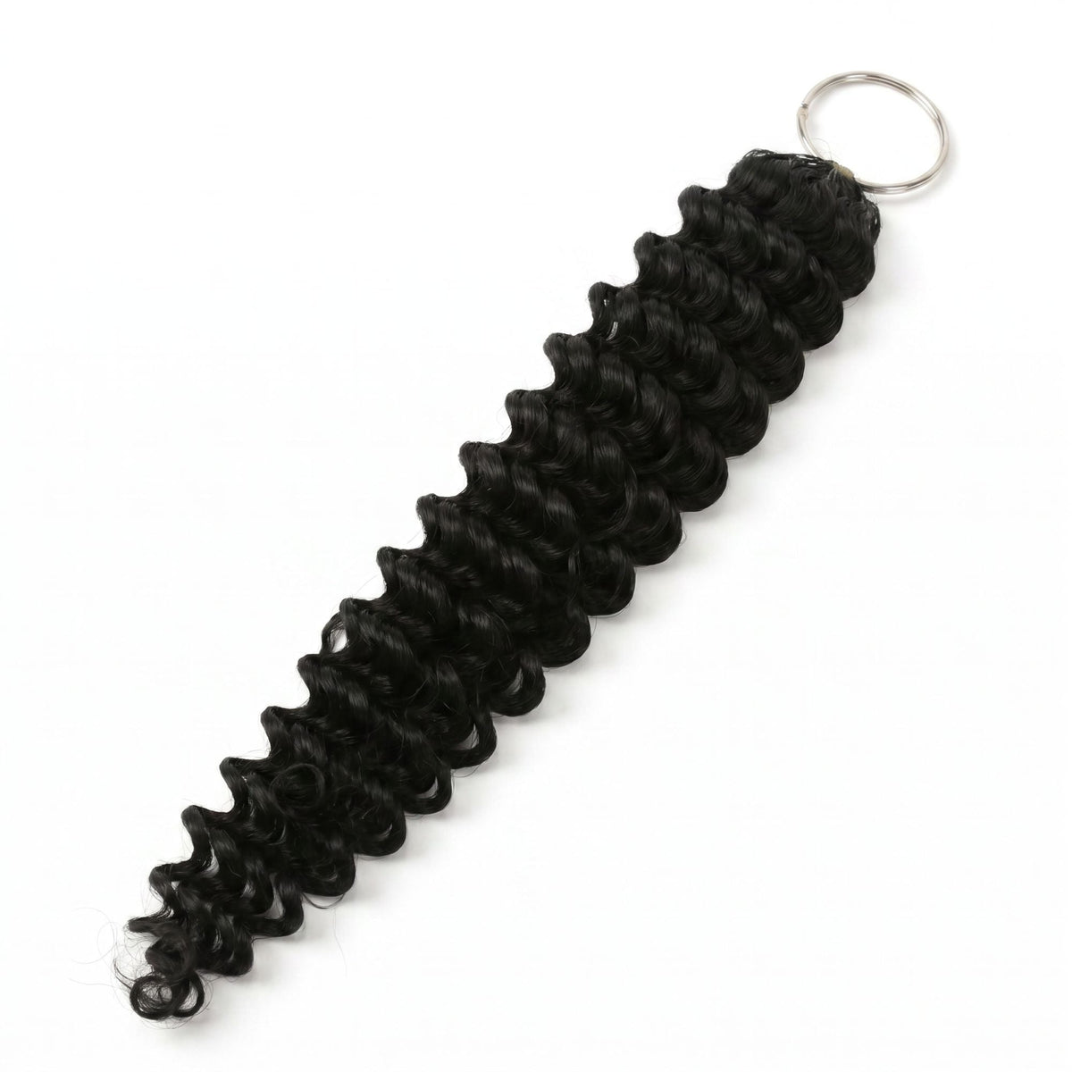 Natural black deep wave feather crochet hair extensions laid diagonally on white showing the wave pattern and metal ring at the loop