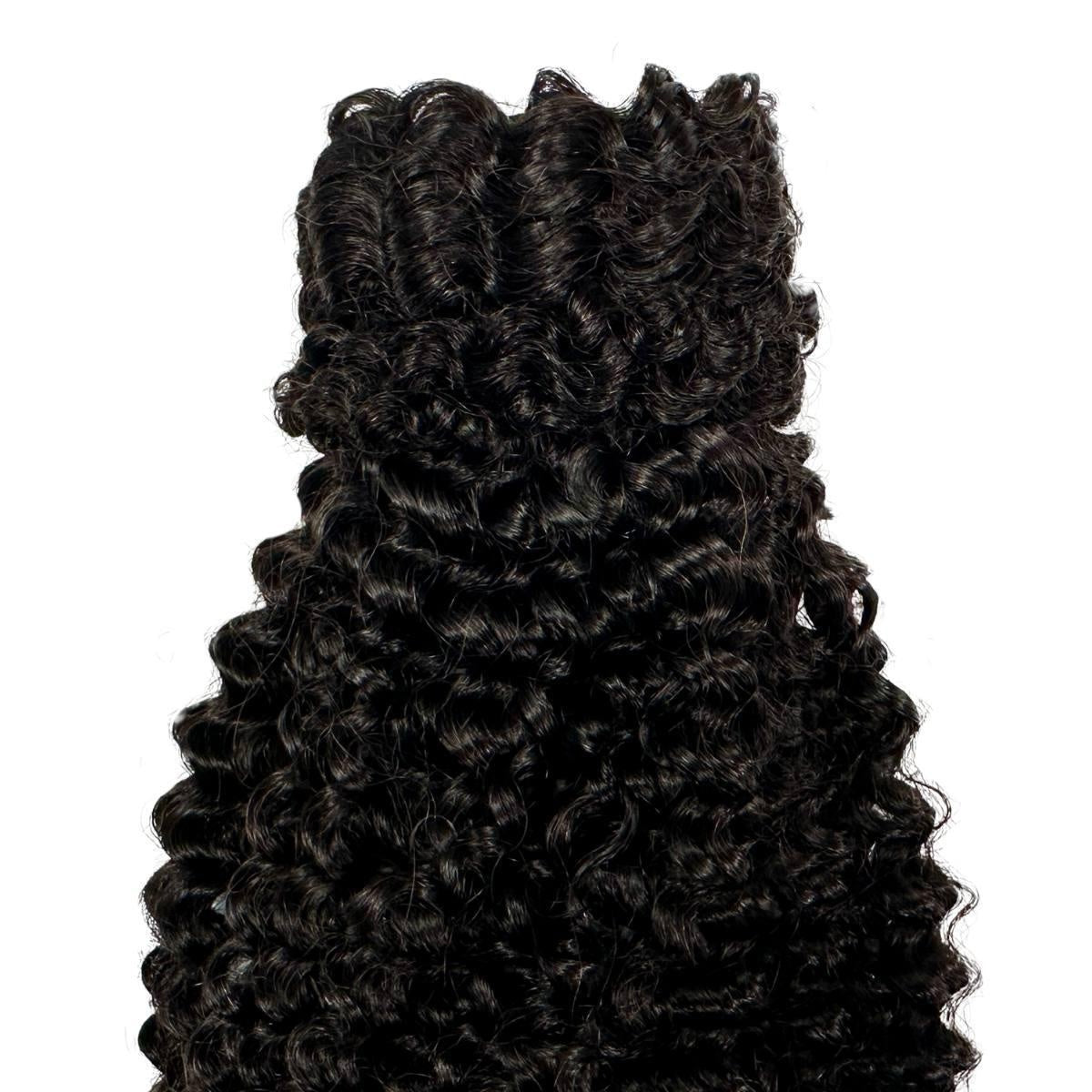 Jerry Curl Ponytail - Close-up of jerry curl natural black 1B human hair ponytail showing defined spiral curl pattern