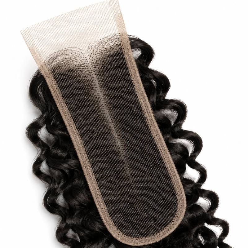 Underside of the narrow HD lace base on natural black kinky curly closure hair extensions showing the hairline knots and bound edge