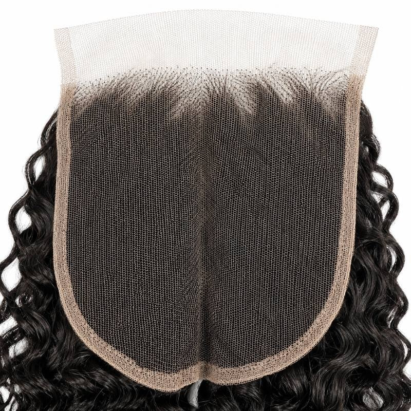 Underside of the square HD lace base on natural black kinky curly closure hair extensions showing the hairline knots and bound edge