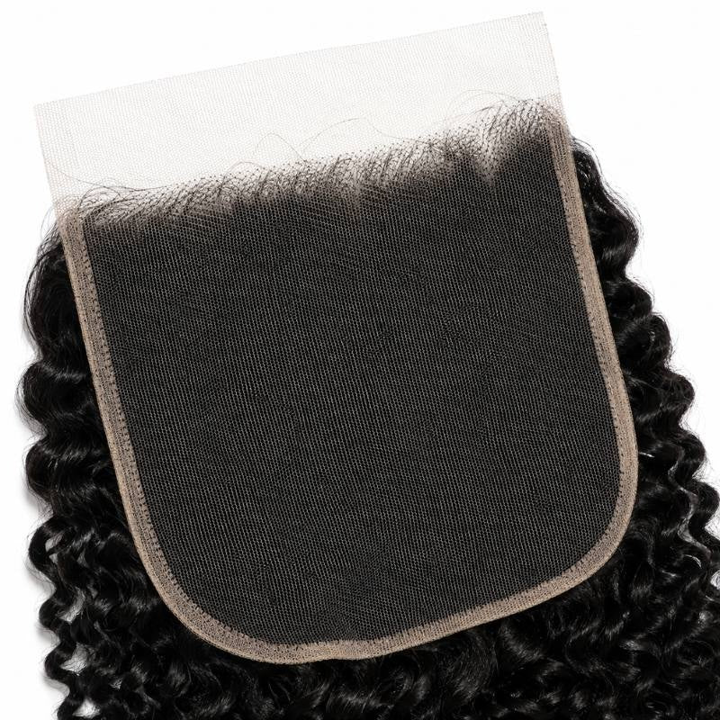 Underside of the wide HD lace base on natural black kinky curly closure hair extensions showing the hairline knots and rounded corners