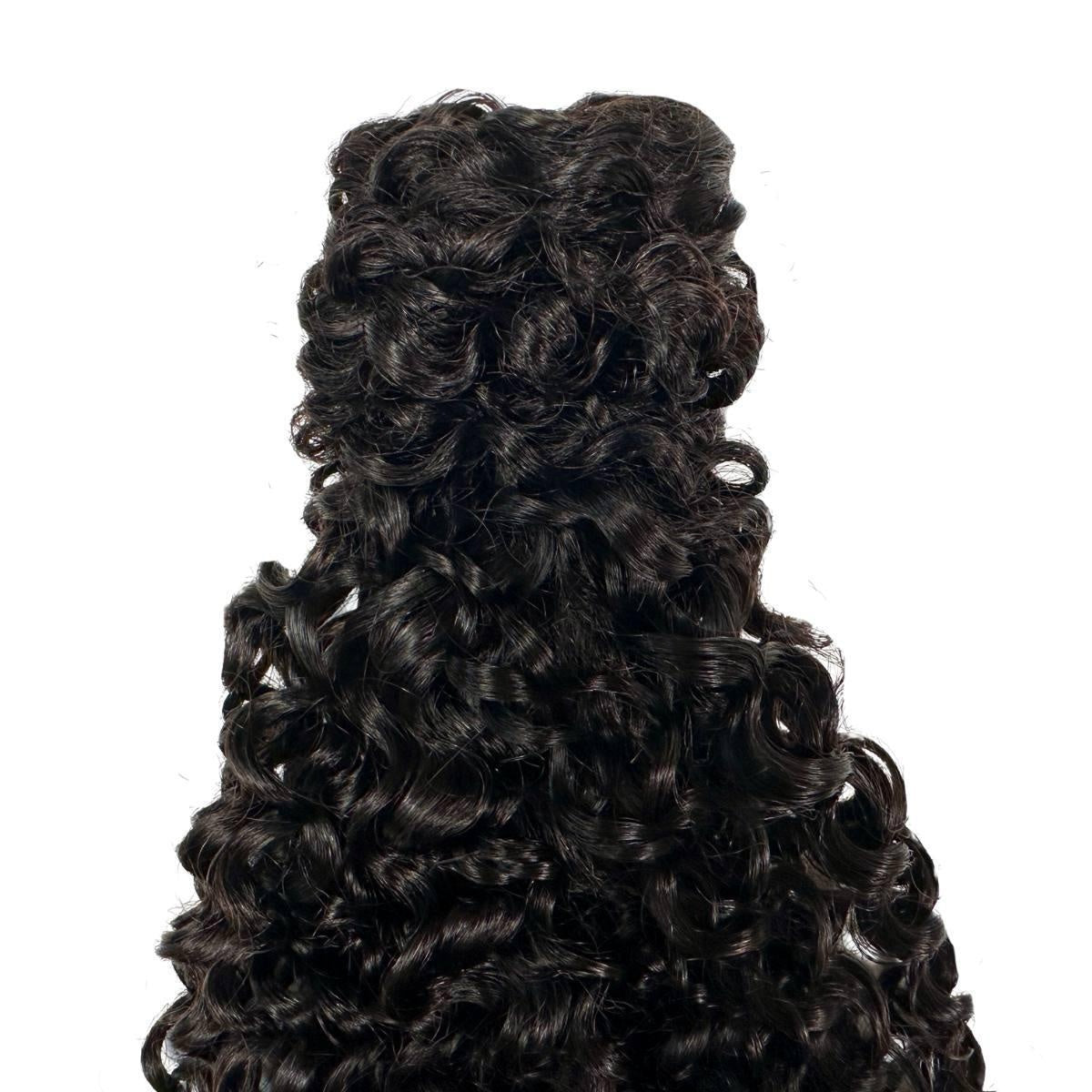 Kinky Curly Ponytail - Natural black 1B kinky curly human hair ponytail, close-up of springy defined curl pattern, product on white background