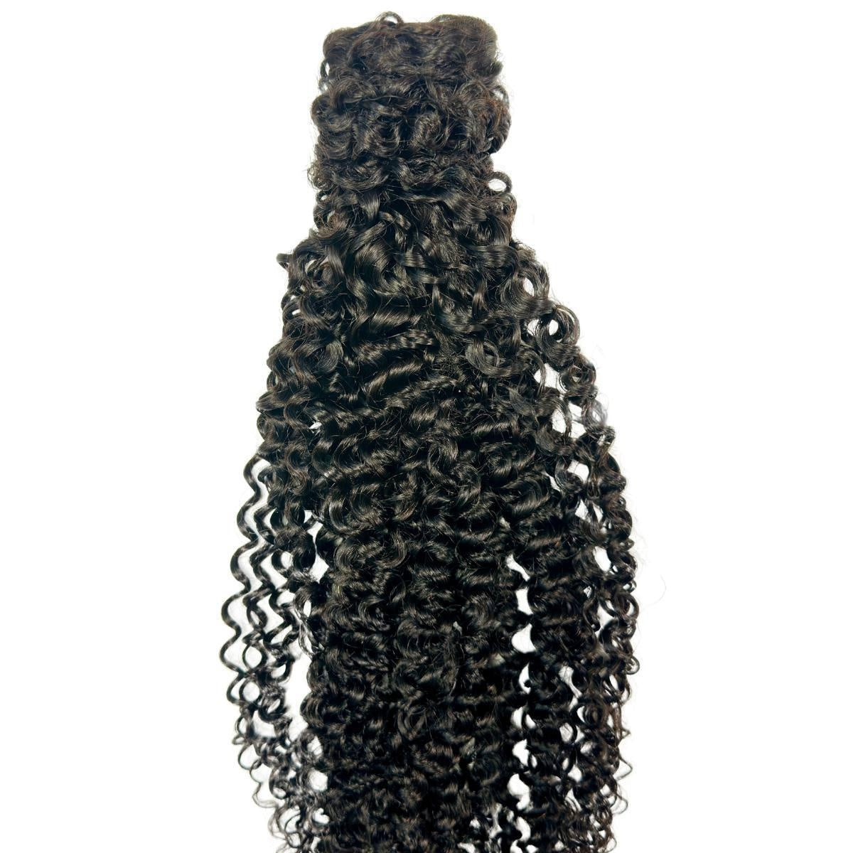 Kinky Curly Ponytail - Full-length natural black 1B kinky curly ponytail extension displayed vertically, showing dense curl coverage on white
