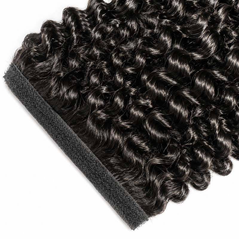 Close-up of the hook and loop strip stitched along the top edge of natural black kinky curly ponytail hair extensions