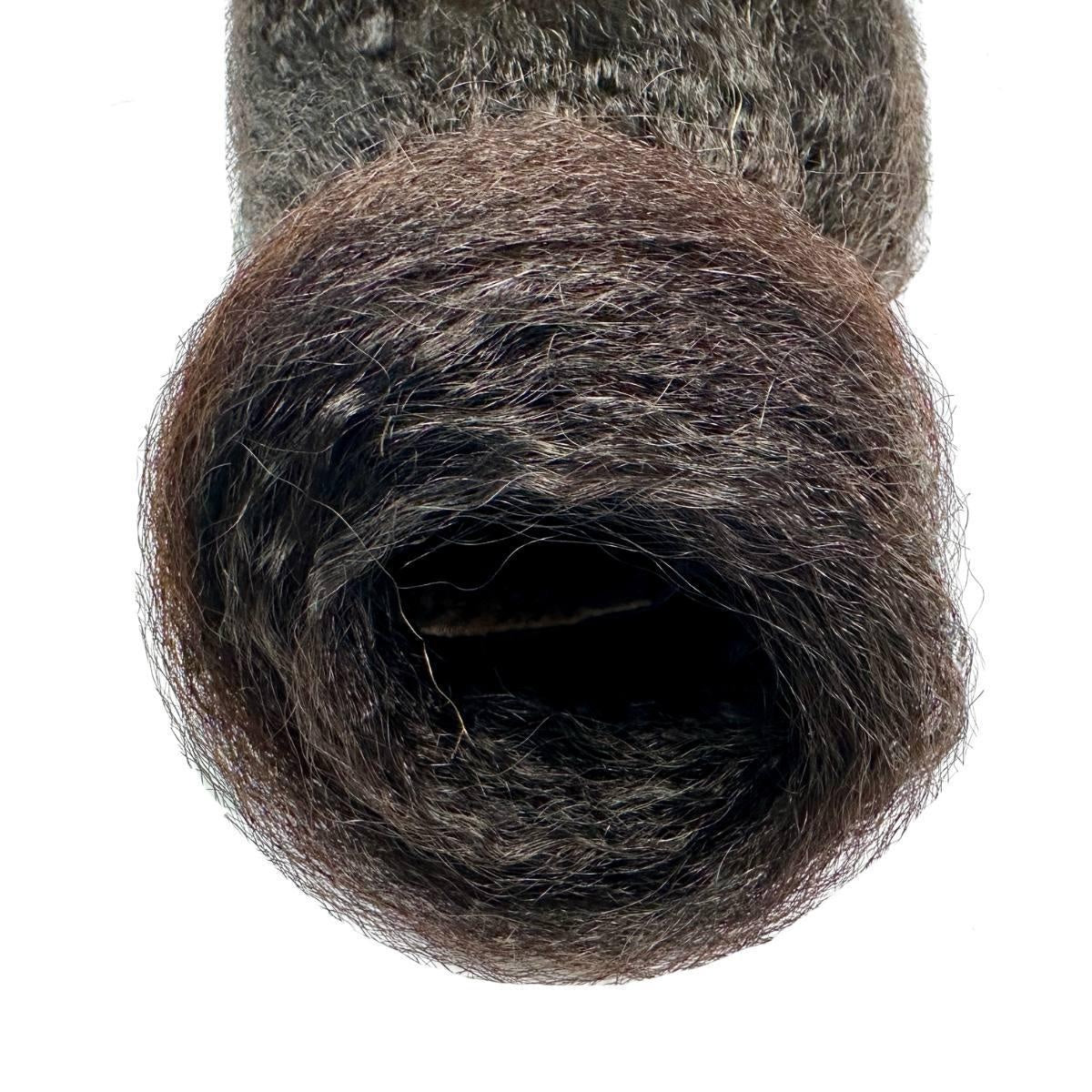 Kinky Straight Ponytail - Close-up of natural black 1B kinky straight ponytail ends showing fine coarse-straight texture on white background