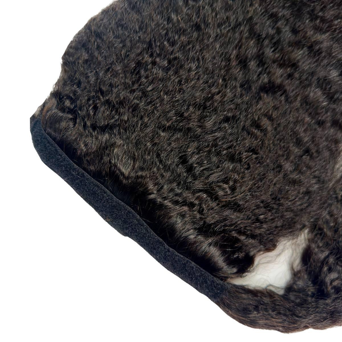 Kinky Straight Ponytail - Detail of natural black 1B kinky straight ponytail wrap strip with velcro closure and coarse texture on white