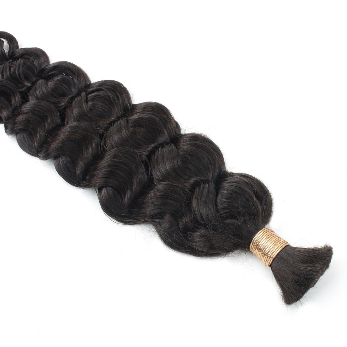 Close-up of the gold band tie and loose cut ends on a bundle of natural black wavy bulk braiding hair extensions
