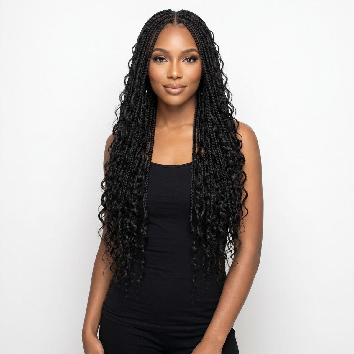 Model wearing long knotless braids with curly ends in natural black bulk braiding hair extensions, front view on a white background