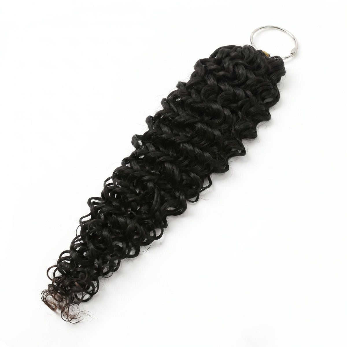 Hank of natural black ocean wave crochet hair extensions laid diagonally on a white background with the ring at the looped end