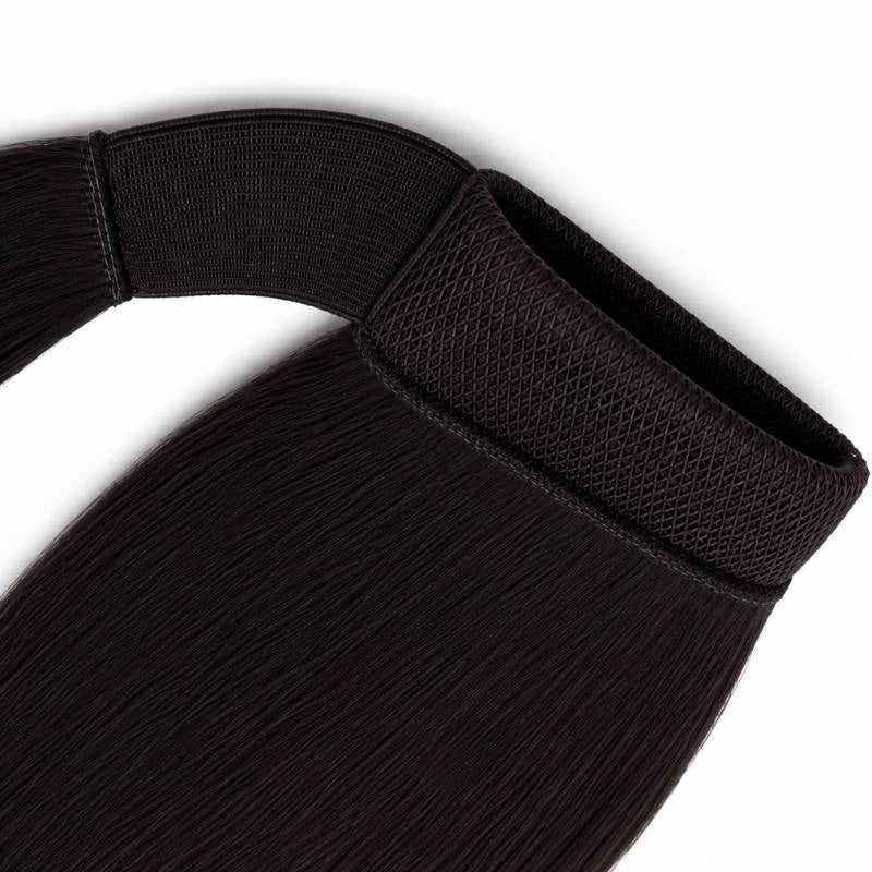 Macro close-up of the mesh wrap band and strap at the top of natural black straight ponytail hair extensions