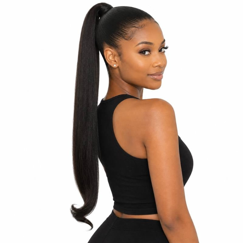 Model looking back over her shoulder wearing a high ponytail in natural black straight hair extensions with the wrapped base on show