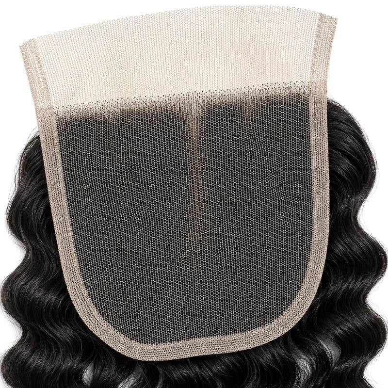 Macro close-up of the lace mesh and bound edge on natural black spiral wave transparent lace closure hair extensions