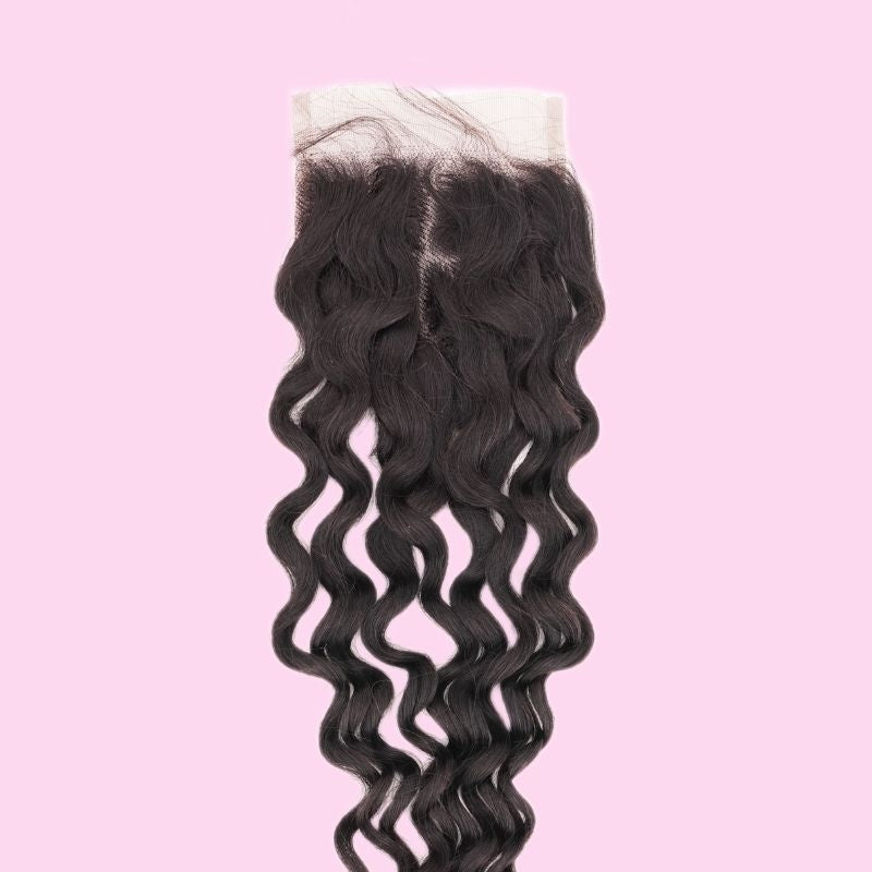 Natural black spiral wave transparent lace closure hair extensions on a pink backdrop showing the middle part and the lace panel