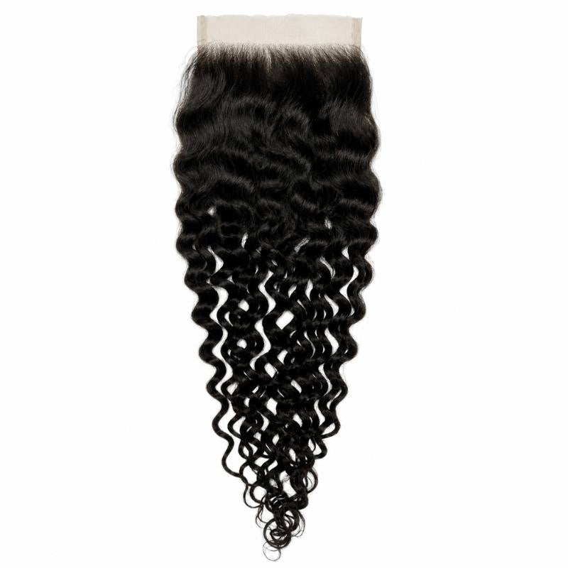 Natural black spiral wave lace closure hair extensions hanging in full with the wide lace panel at the top and tight curls at the ends