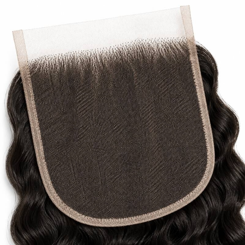Underside close-up of the lace base and knotting on natural black spiral wave lace closure hair extensions