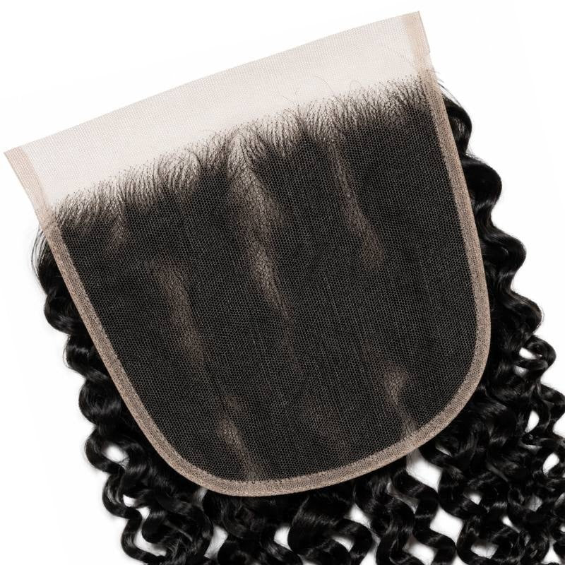 Tilted close-up of the lace base and stitched edge on natural black spiral wave lace closure hair extensions with curls around it