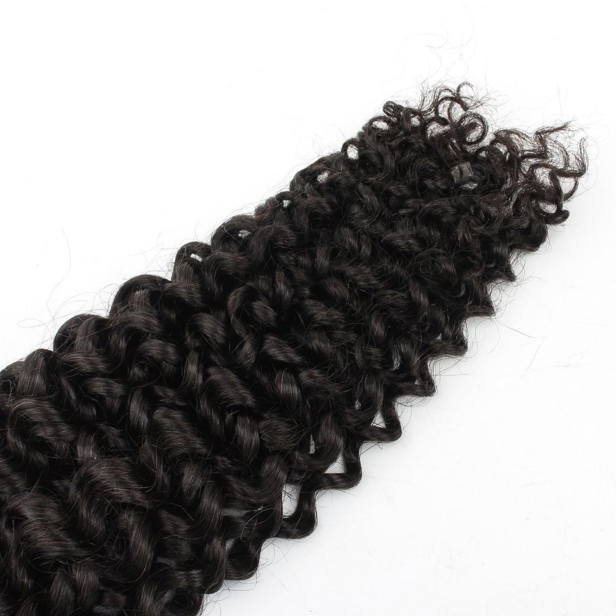 Close-up of the water wave curl pattern and tapered tips on natural black bulk braiding hair extensions