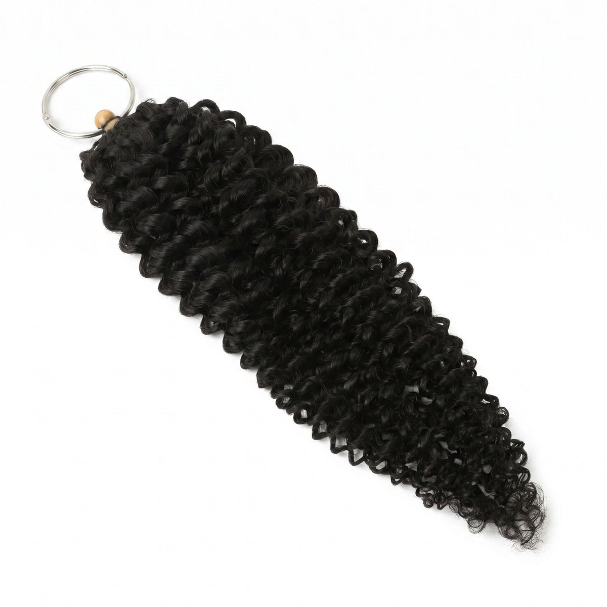 Natural black water wave crochet hair extensions laid on white with the metal ring and gold band holding the looped end