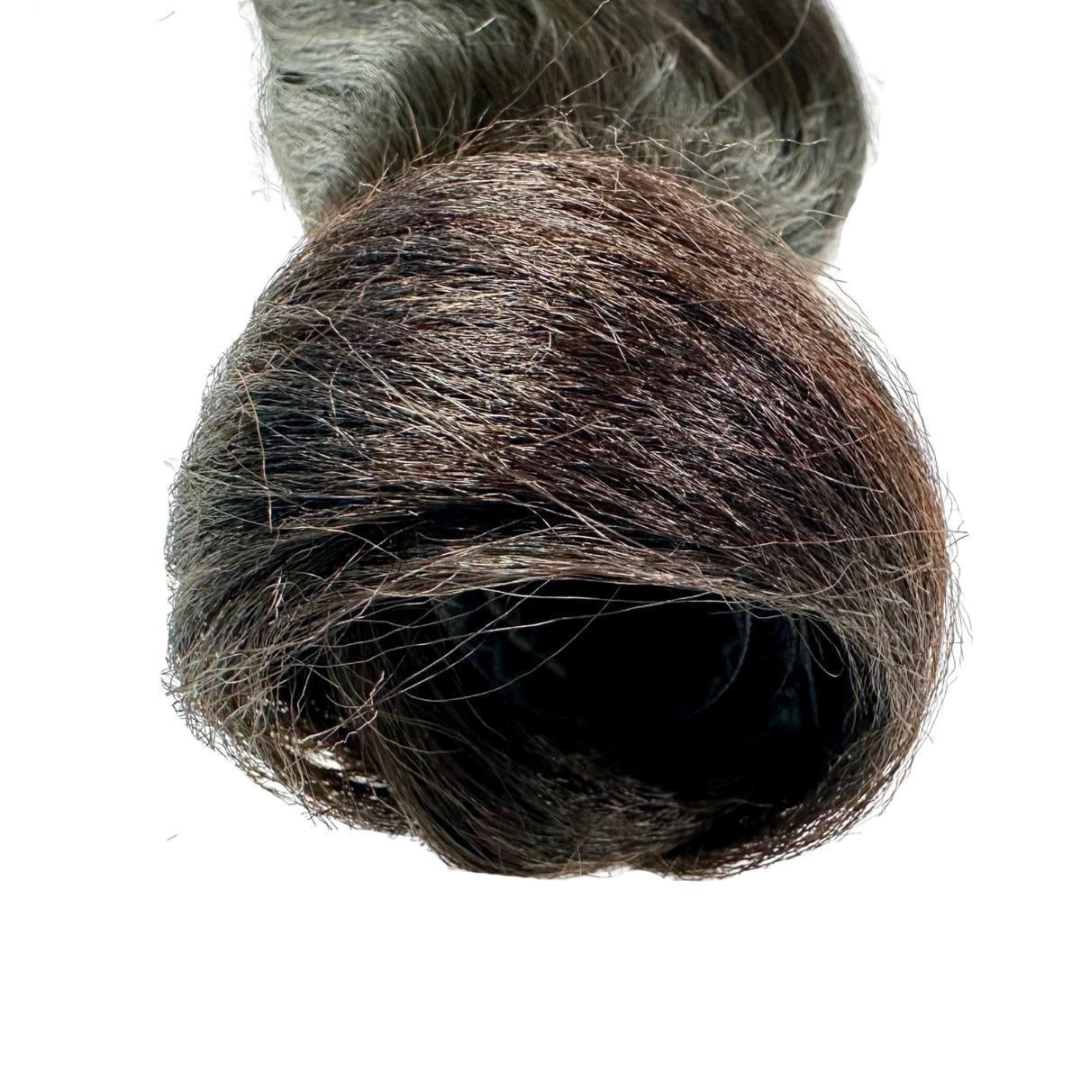Yaki Straight Ponytail - Close-up of natural black 1B yaki straight ponytail ends showing silky yaki-straight texture on white background